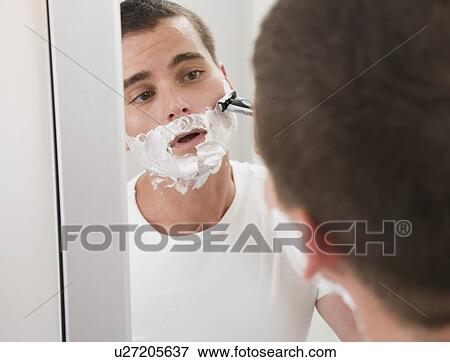 Man shaving in mirror View Large Photo Image Stock Photo - Man shaving in mirror. Fotosearch