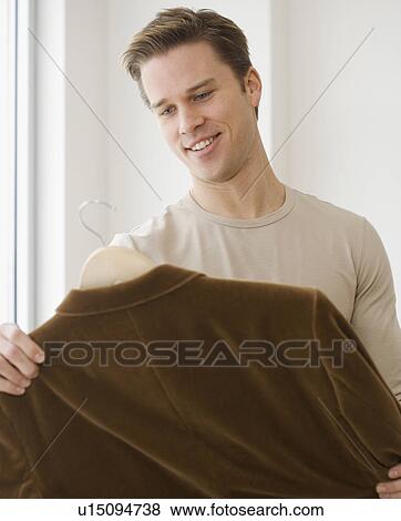 Man shopping for clothing View Large Photo Image Stock Photo - Man shopping for clothing. Fotosearch