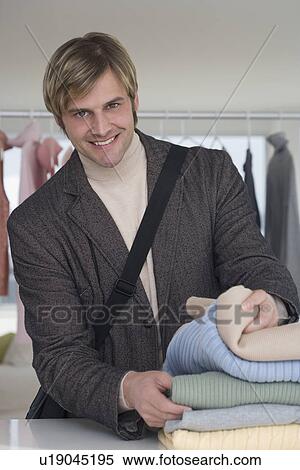 Man shopping for clothing View Large Photo Image Stock Photography - Man shopping for clothing. Fotosearch