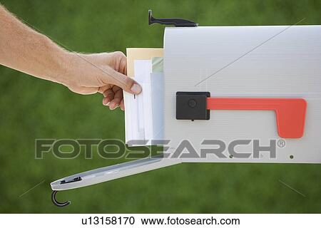 Man taking mail out of mailbox View Large Photo Image Stock Image - Man taking mail out of mailbox. Fotosearch
