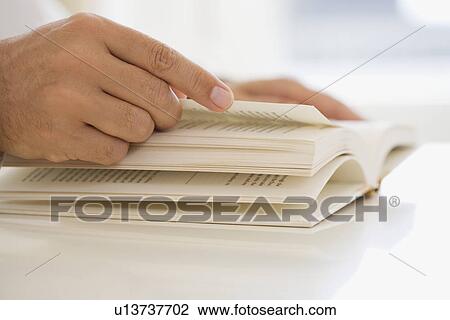 Man turning page of book View Large Photo Image Stock Image - Man turning page of book. Fotosearch