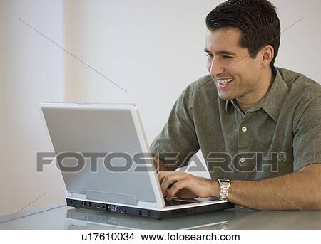 Man typing on laptop View Large Photo Image Picture - Man typing on laptop. Fotosearch