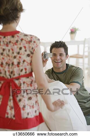 Man video recording girlfriend View Large Photo Image Stock Photograph - Man video recording girlfriend. Fotosearch