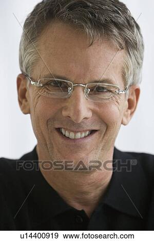 Man wearing eyeglasses View Large Photo Image Stock Photo - Man wearing eyeglasses. Fotosearch