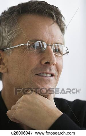 Man wearing eyeglasses View Large Photo Image Stock Photo - Man wearing eyeglasses. Fotosearch