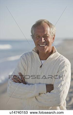 Stock Image - Man with arms crossed. Fotosearch