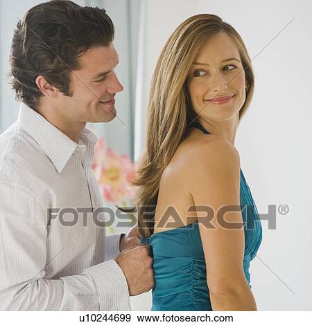 Man zipping up wife’s dress View Large Photo Image Stock Photo - Man zipping up wife’s dress. Fotosearch