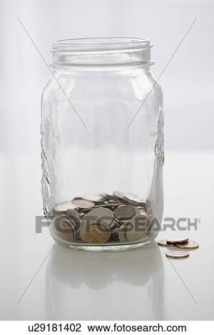 Stock Image - Mason jar with change. Fotosearch