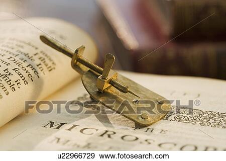 Model of Leeuwenhoek microscope on book View Large Photo Image Stock Photo - Model of Leeuwenhoek microscope on book. Fotosearch