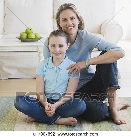 Mother and daughter sitting on floor View Large Photo Image Stock Image - Mother and daughter sitting on floor. Fotosearch