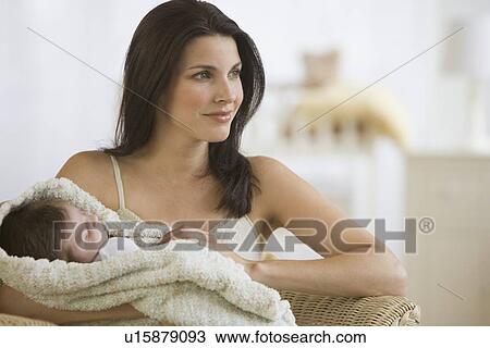 Mother holding baby View Large Photo Image Stock Image - Mother holding baby. Fotosearch