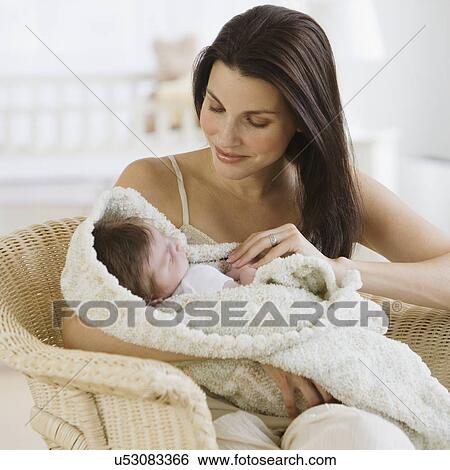 Mother smiling at baby View Large Photo Image Stock Photograph - Mother smiling at baby. Fotosearch
