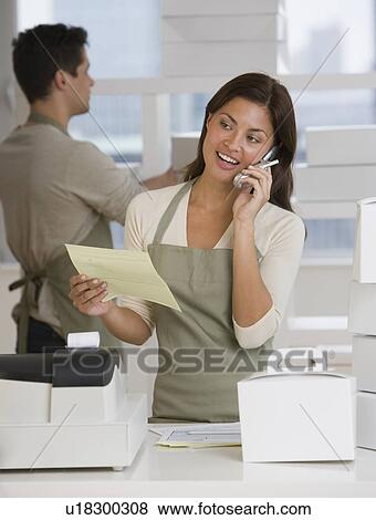 Multi-ethnic bakery workers behind counter View Large Photo Image Stock Photo - Multi-ethnic bakery workers behind counter. Fotosearch