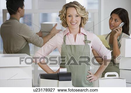 Multi-ethnic bakery workers behind counter View Large Photo Image Stock Photo - Multi-ethnic bakery workers behind counter. Fotosearch