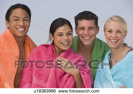 Multi-ethnic friends with towels View Large Photo Image Stock Photograph - Multi-ethnic friends with towels. Fotosearch