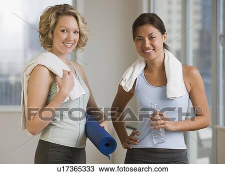 Stock Image - Multi-ethnic women in athletic gear. Fotosearch