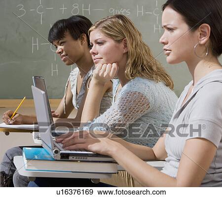 Multi-ethnic women in classroom View Large Photo Image Stock Photo - Multi-ethnic women in classroom. Fotosearch