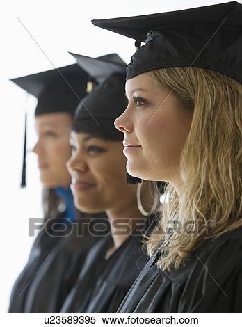 Multi-ethnic women wearing graduation cap and gown View Large Photo Image Stock Photography - Multi-ethnic women wearing graduation cap and gown. Fotosearch