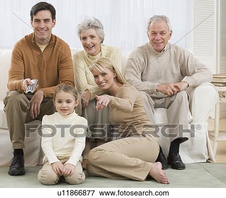 Multi-generational family watching television View Large Photo Image Stock Photo - Multi-generational family watching television. Fotosearch