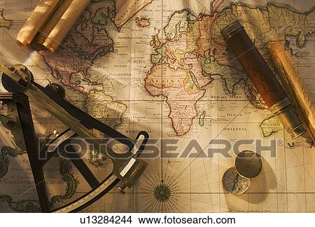 Picture - Octant, compass and telescope on nautical map. Fotosearch