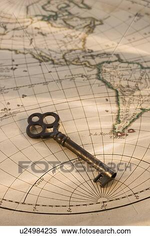 Old fashioned key on globe map View Large Photo Image Stock Photography - Old fashioned key on globe map. Fotosearch