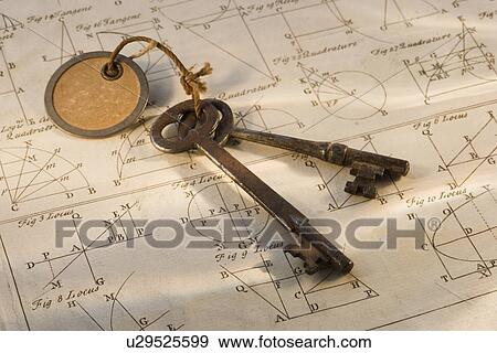 Stock Photo - Old fashioned keys on sheet of geometry. Fotosearch
