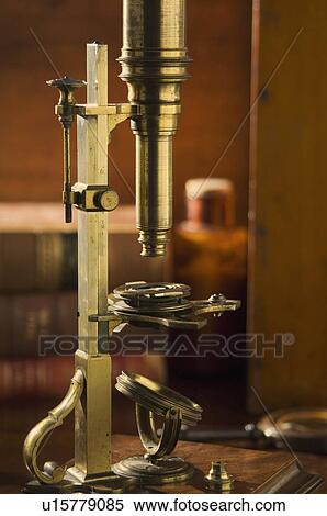 Old fashioned microscope on table View Large Photo Image Stock Photography - Old fashioned microscope on table. Fotosearch