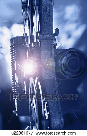 Old fashioned movie projector playing film View Large Photo Image Stock Photo - Old fashioned movie projector playing film. Fotosearch