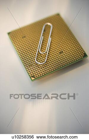 Stock Photograph - Paper clip on computer chip. Fotosearch