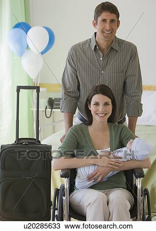 Parents leaving hospital with newborn View Large Photo Image Stock Image - Parents leaving hospital with newborn. Fotosearch