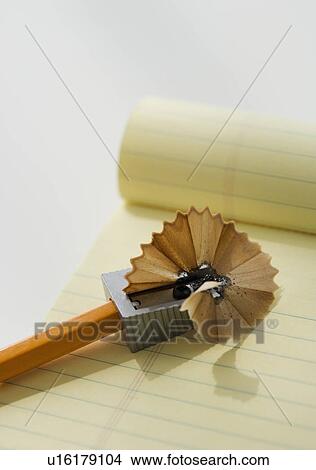 Pencil in sharpener on note pad View Large Photo Image Picture - Pencil in sharpener on note pad. Fotosearch