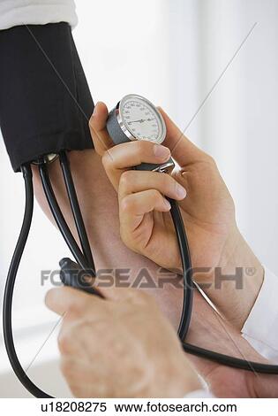 Person having blood pressure measured View Large Photo Image Stock Photography - Person having blood pressure measured. Fotosearch