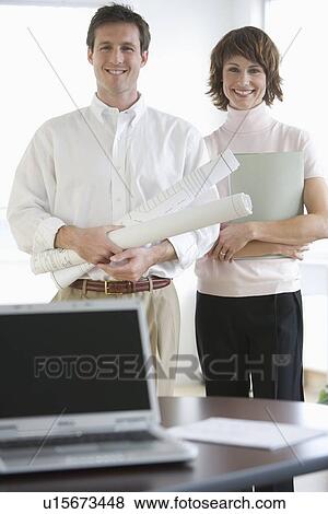 Portrait of businesspeople with blueprints View Large Photo Image Stock Photo - Portrait of businesspeople with blueprints. Fotosearch