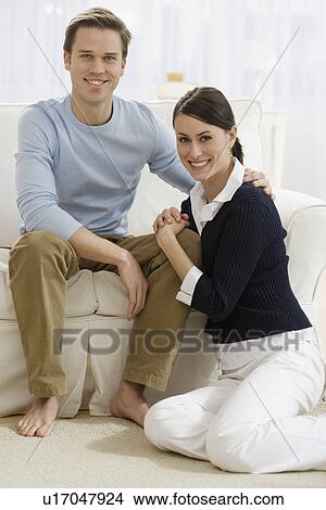 Picture - Portrait of couple in livingroom. Fotosearch