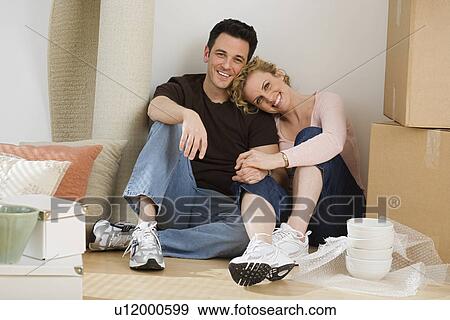 Portrait of couple in new house View Large Photo Image Stock Photo - Portrait of couple in new house. Fotosearch