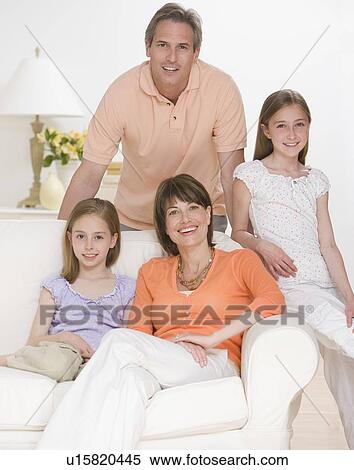 Portrait of family on sofa View Large Photo Image Stock Photography - Portrait of family on sofa. Fotosearch