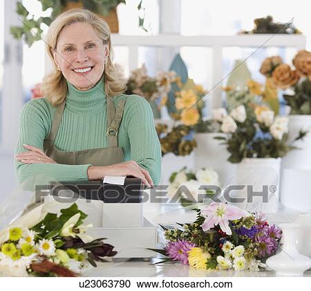 Portrait of female florist at cash register View Large Photo Image Stock Image - Portrait of female florist at cash register. Fotosearch
