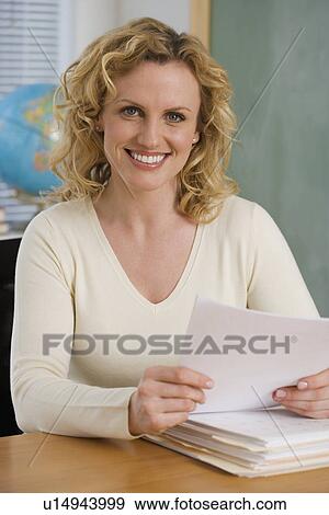 Portrait of female teaching in classroom View Large Photo Image Stock Photo - Portrait of female teaching in classroom. Fotosearch