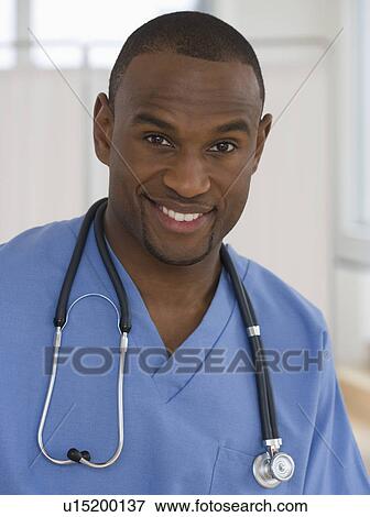 Stock Photo - Portrait of male doctor with stethoscope around neck. Fotosearch