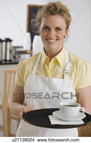 Portrait of waitress in cafe View Large Photo Image Picture - Portrait of waitress in cafe. Fotosearch