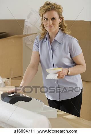 Portrait of woman holding receipts View Large Photo Image Stock Image - Portrait of woman holding receipts. Fotosearch