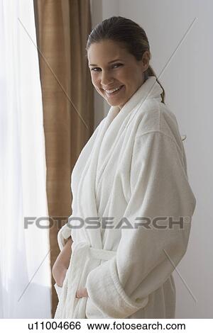Stock Photograph - Portrait of woman wearing bathrobe. Fotosearch