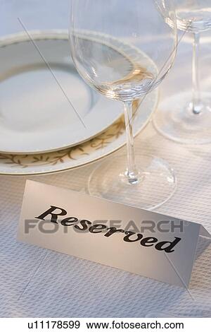 Reserved sign at place setting View Large Photo Image Stock Photo - Reserved sign at place setting. Fotosearch