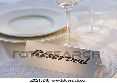 Reserved sign at place setting View Large Photo Image Stock Photograph - Reserved sign at place setting. Fotosearch