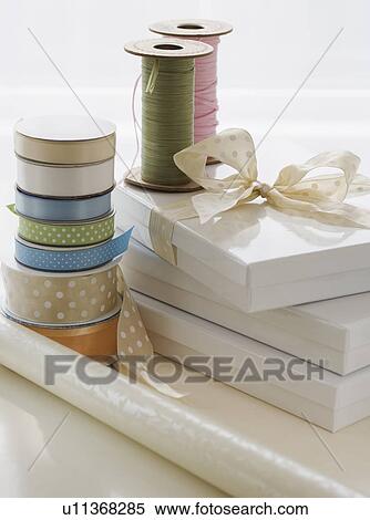 Ribbon, gift boxes and wrapping paper View Large Photo Image Stock Photography - Ribbon, gift boxes and wrapping paper. Fotosearch