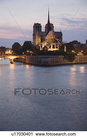 Scenic view of cathedral next to water at night View Large Photo Image Stock Image - Scenic view of cathedral next to water at night. Fotosearch