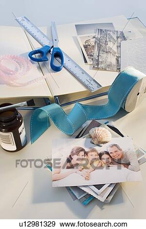 Scrapbooking supplies on table View Large Photo Image Stock Photo - Scrapbooking supplies on table. Fotosearch