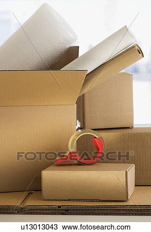 Shipping boxes and packing supplies View Large Photo Image Stock Image - Shipping boxes and packing supplies. Fotosearch