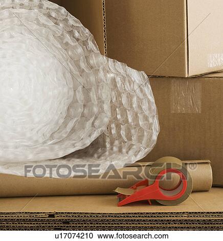 Stock Image - Shipping boxes and packing supplies. Fotosearch