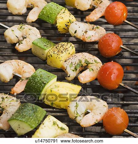 Shish kebab cooking on grill View Large Photo Image Stock Image - Shish kebab cooking on grill. Fotosearch